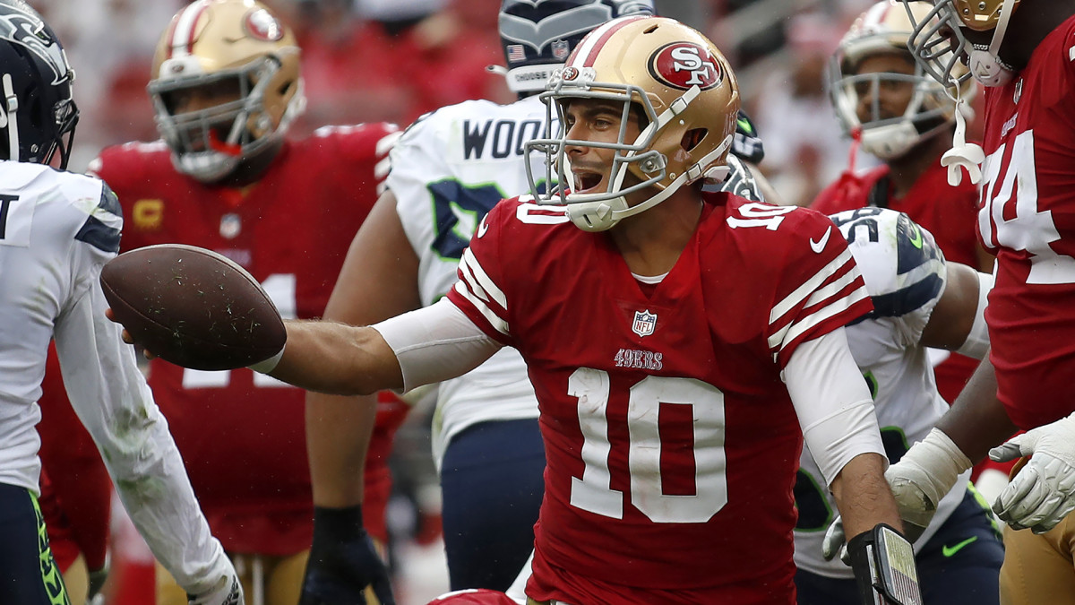 Jimmy Garoppolo smiles after a play during the 49ers’ victory over the Seahawks.